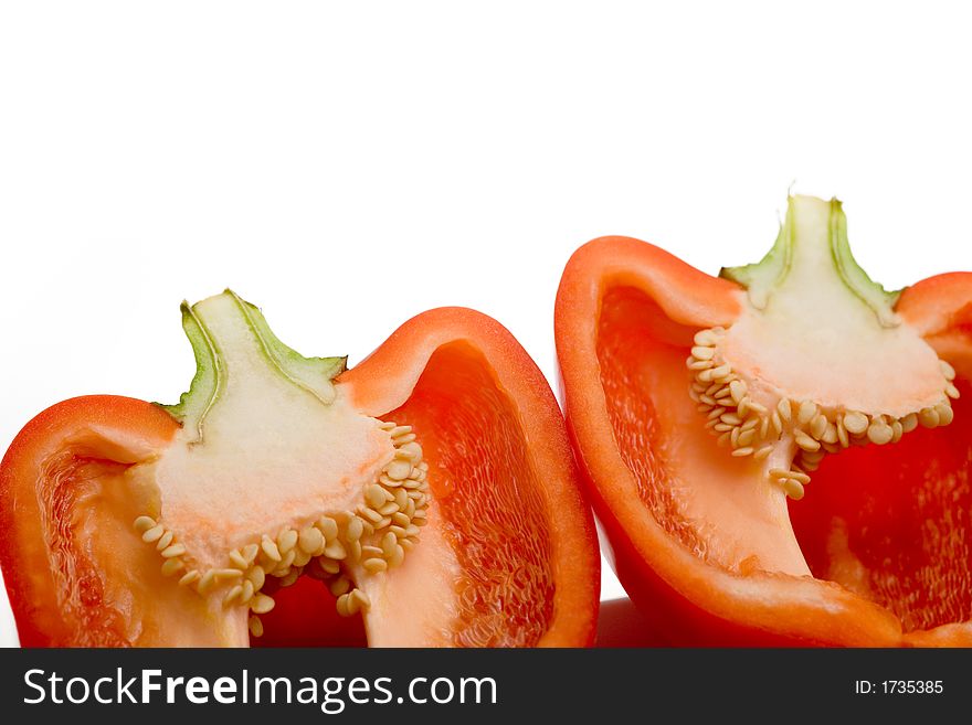 Divided Red Bell Pepper on white background. Divided Red Bell Pepper on white background.