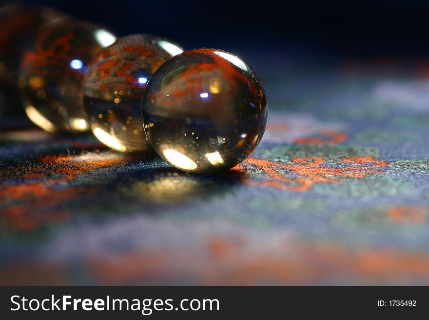 A close-up of glisten balls on the pattern background