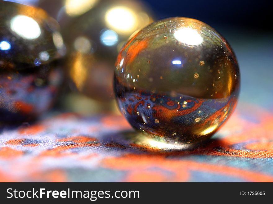 A close-up of glisten balls on the pattern background