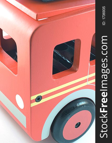 Iamge of a wooden toy fire engine in closeup