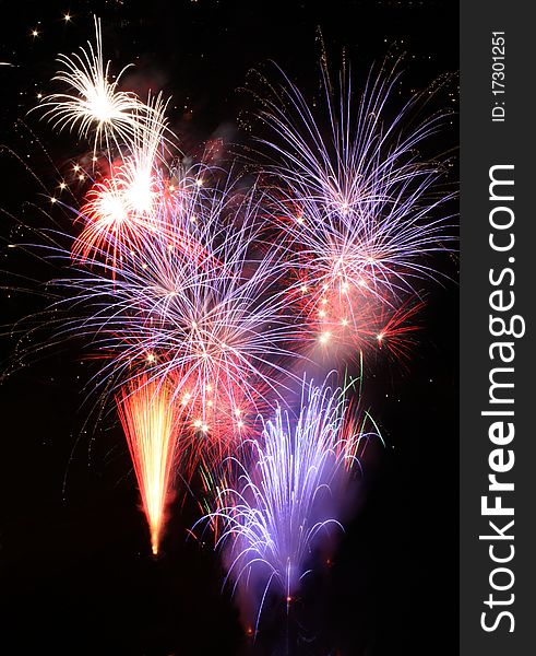 Colorful large fireworks exploding in different colours. Colorful large fireworks exploding in different colours