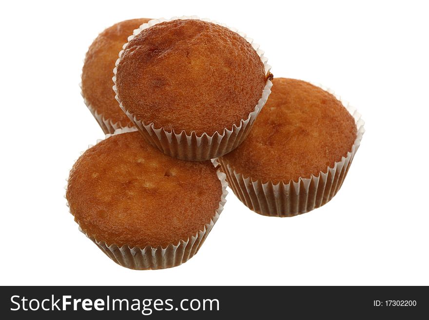 Four fruitcakes are isolated on a white background