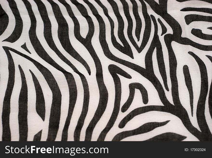 The background of textured black and white synthetic fabric closeup