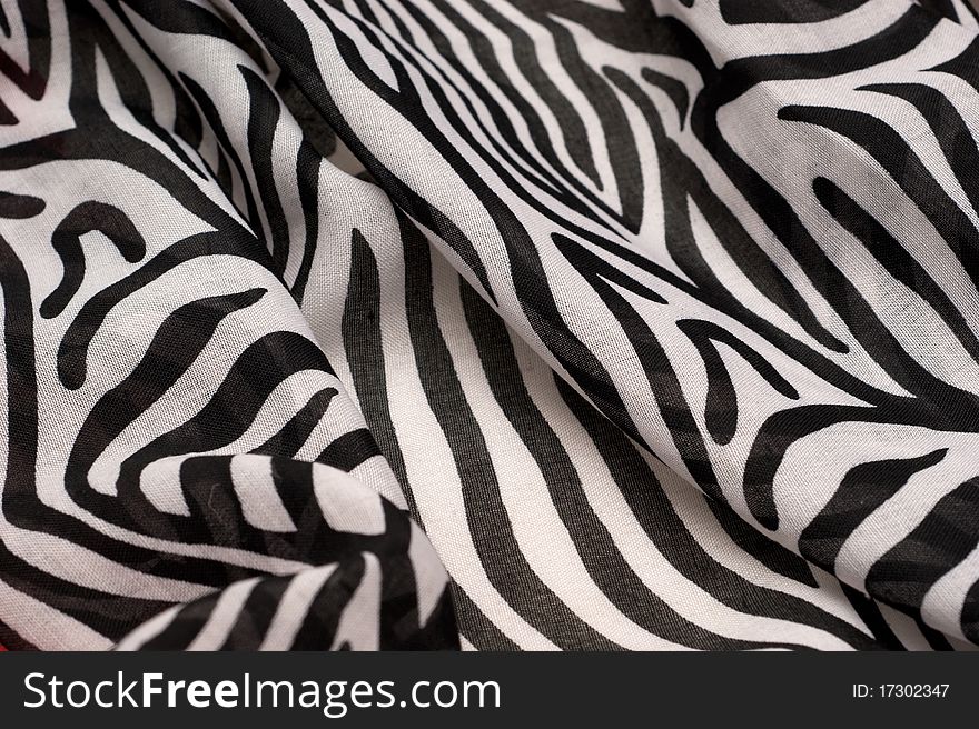 The background of textured black and white synthetic fabric closeup