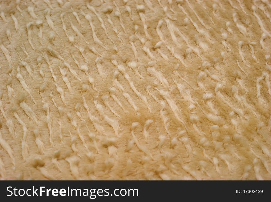 The background of textured bright synthetic fabric closeup