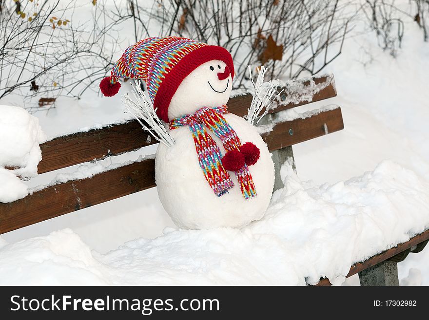 Snowman, symbol made in winter time with bonned and scarf