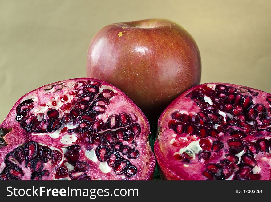 Pomegranate (Punica granatum) and apple in arrangement with close up