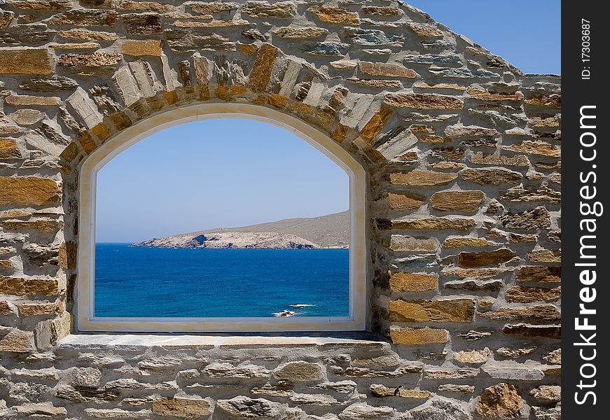 Arched window overlooking the sea.