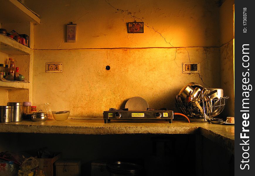 A traditional old Indian style generic kitchen photograph with sunburst colors. A traditional old Indian style generic kitchen photograph with sunburst colors.