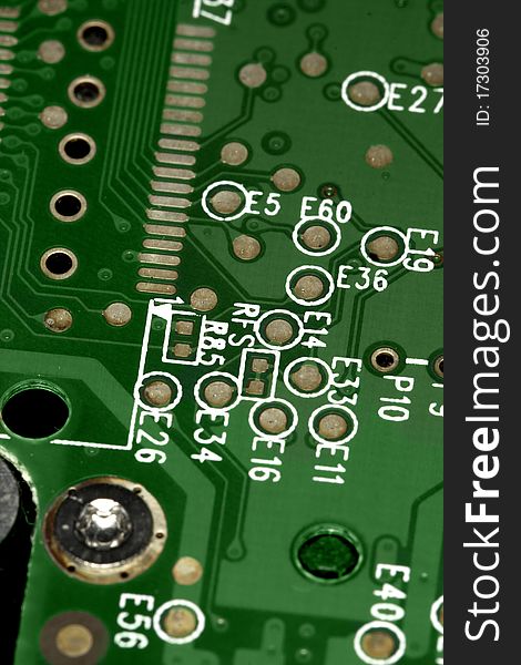 Close view detail of a green computer circuit board.