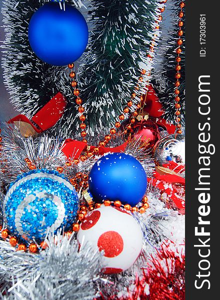 Christmas decoration with tinsel ribbons and globes