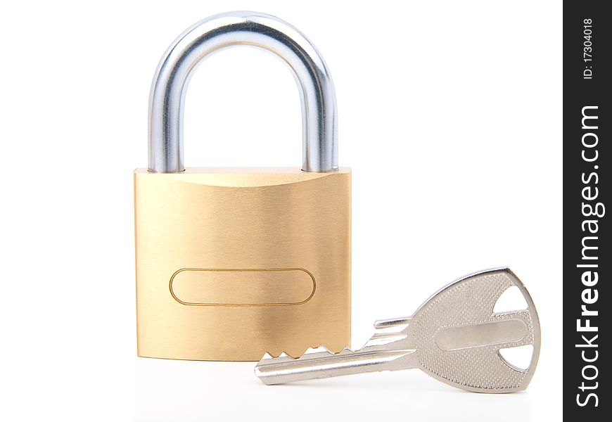 Golden closed padlock with key, isolated on the white background