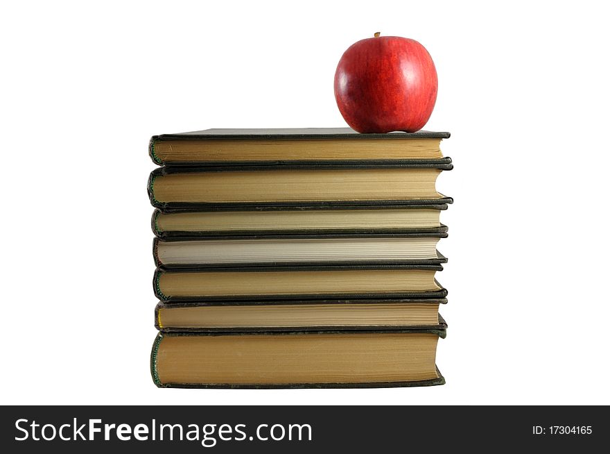 Books and apple on white background