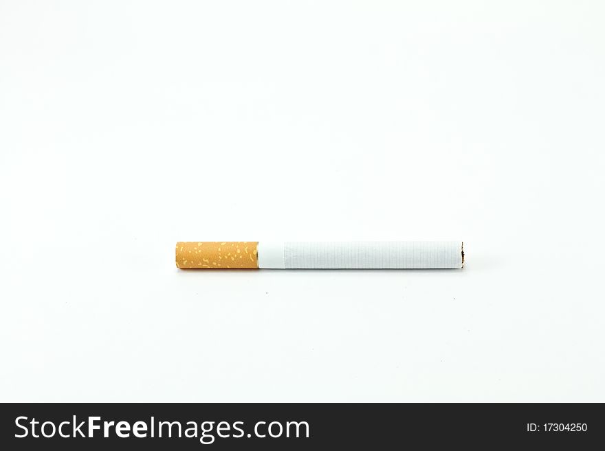 Single cigarette isolated on white
