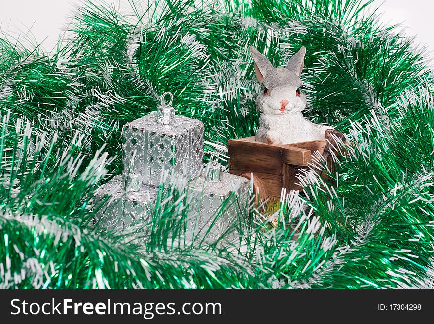 Rabbit is porcelain in a green new-year shower. Rabbit is porcelain in a green new-year shower