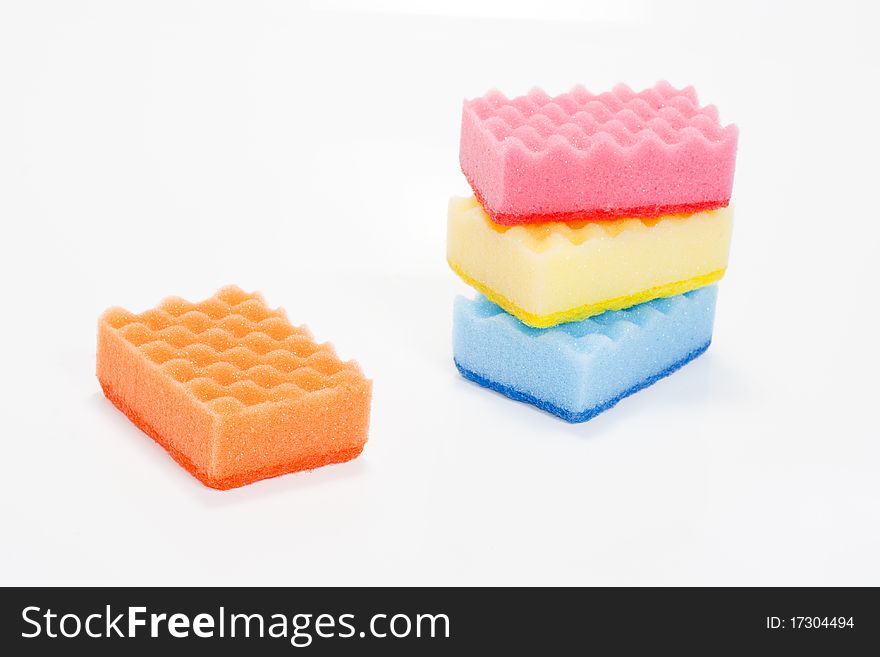 One and a few bath sponges isolated on a white background