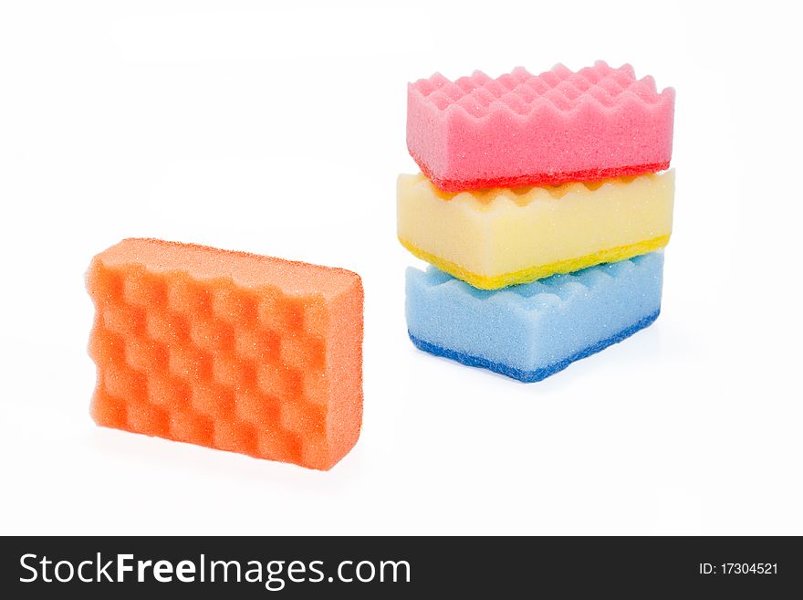 Few varicoloured bath sponges isolated on a white background