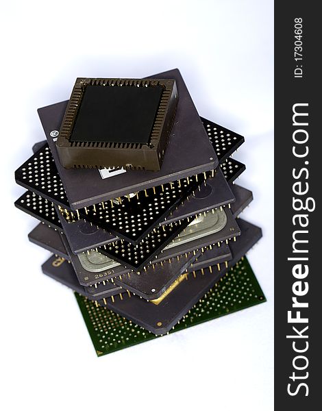 Close view detail of some computer microprocessors isolated on a white background.