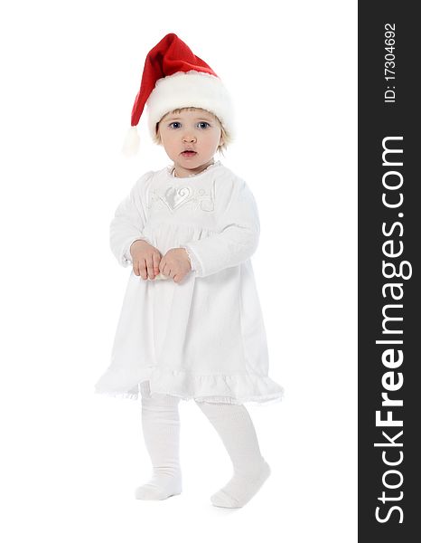 Thoughtful baby in Santa's hat. Thoughtful baby in Santa's hat