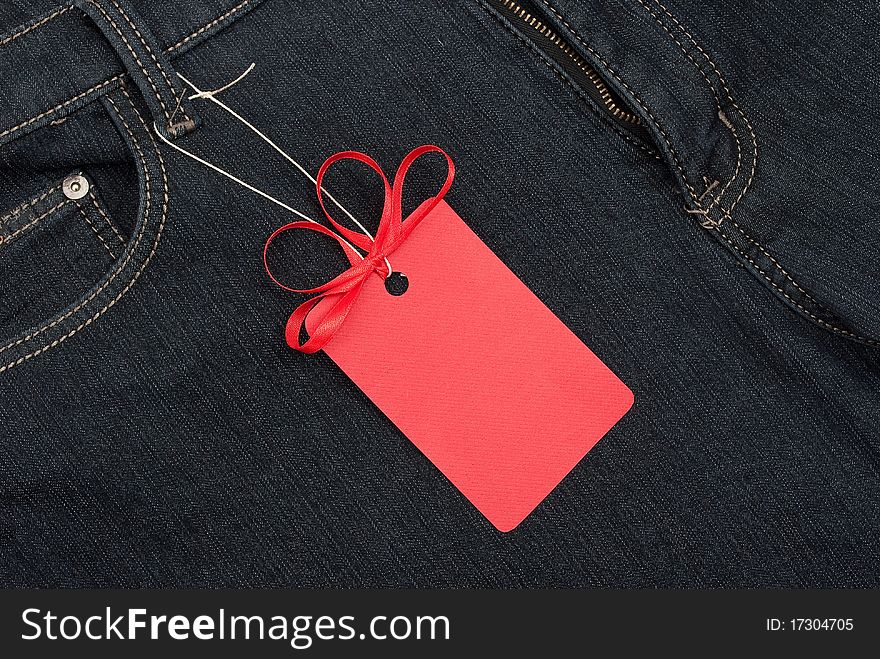 Red price tag over jeans