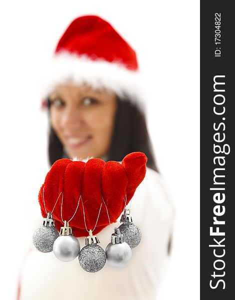 female Santa offering silver ornaments in her hand. female Santa offering silver ornaments in her hand