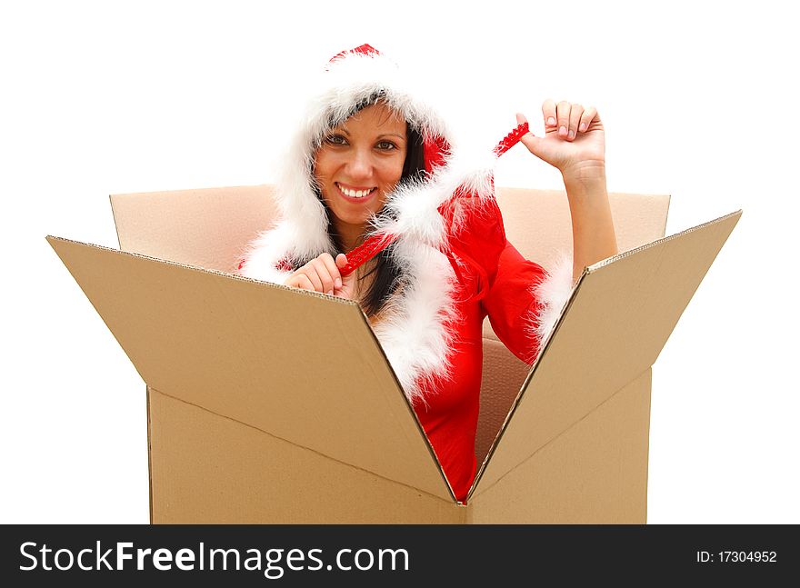 Attractive female Santa coming out from a big box with her panties in her hand. Attractive female Santa coming out from a big box with her panties in her hand