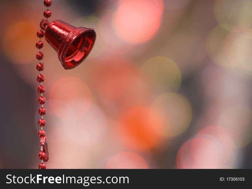 Christmas decoration with red bells and red beaded garland