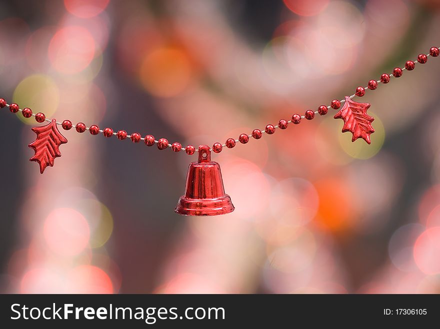 Christmas decoration with red bells and red beaded garland