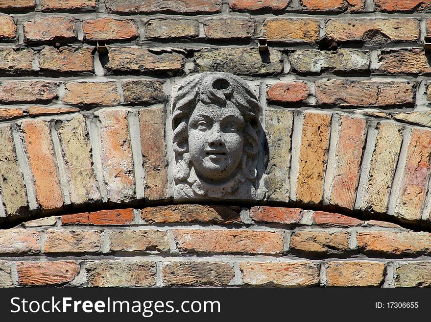 One of the many concrete faces found on the buildings from the 1700's in Brugge, Belgium. The faces on the buildings of that time were thought to keep away evil spirits. One of the many concrete faces found on the buildings from the 1700's in Brugge, Belgium. The faces on the buildings of that time were thought to keep away evil spirits.