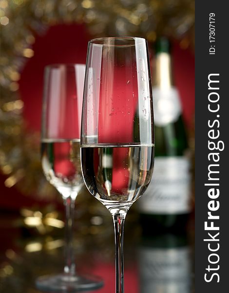 Champagne in glasses on a red background. Champagne in glasses on a red background