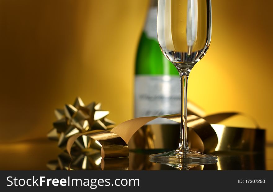 Champagne in glasses on a yellow background. Champagne in glasses on a yellow background