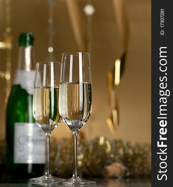 Champagne in glasses on a yellow background. Champagne in glasses on a yellow background