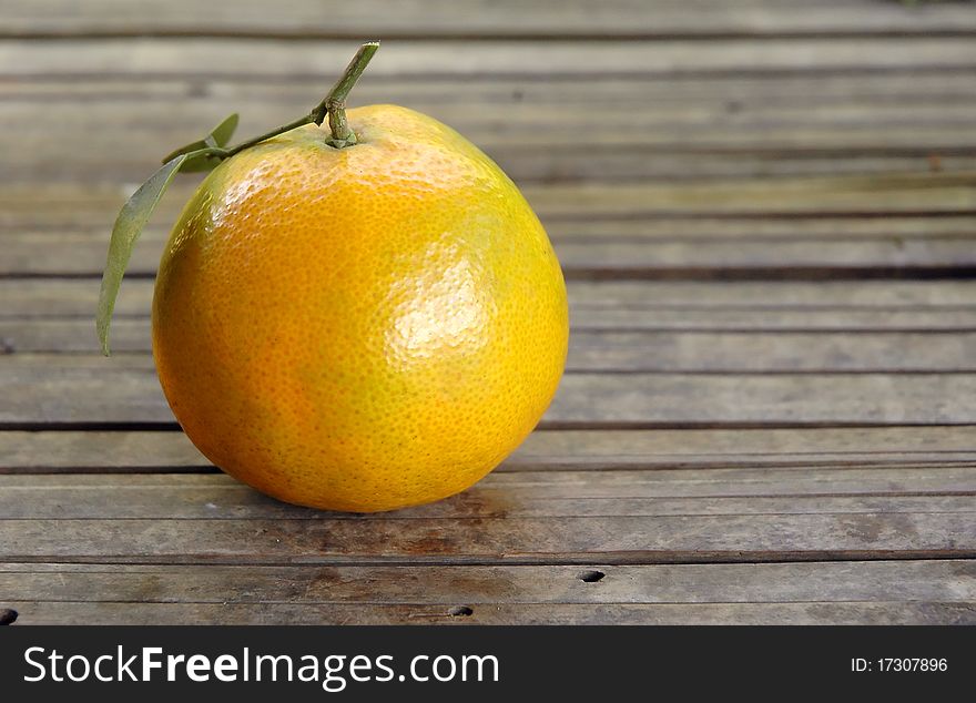 Fresh orange on wood background