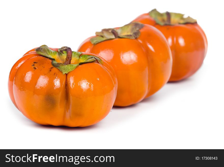 Ripe persimmons isolated on a white background