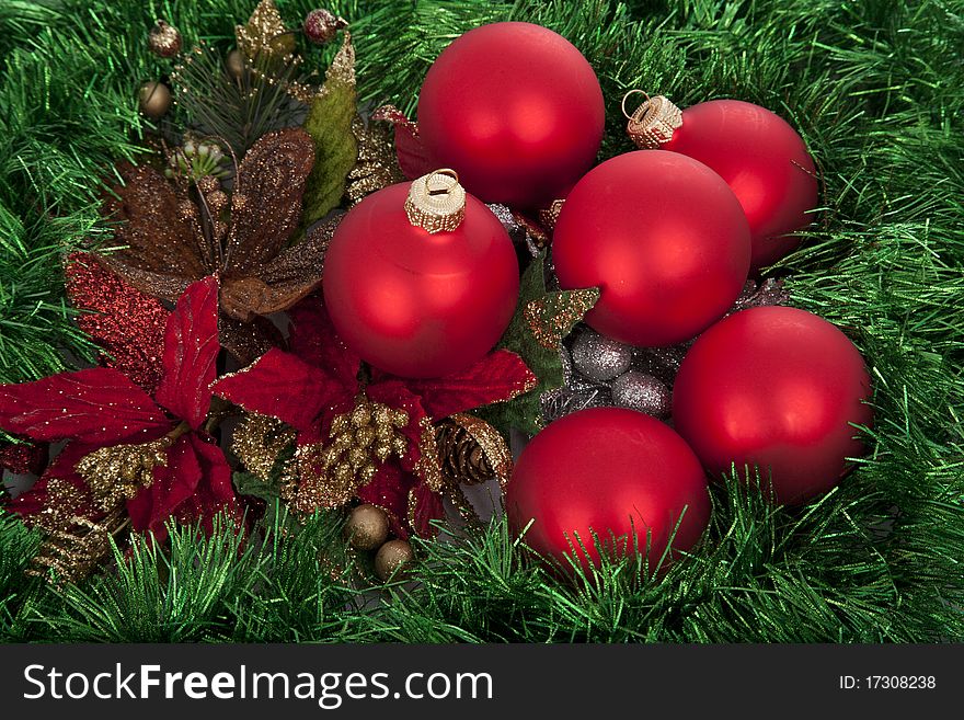 Christmas red balls on green decorated background