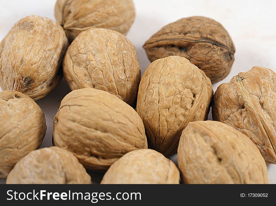 Close up of many walnuts.