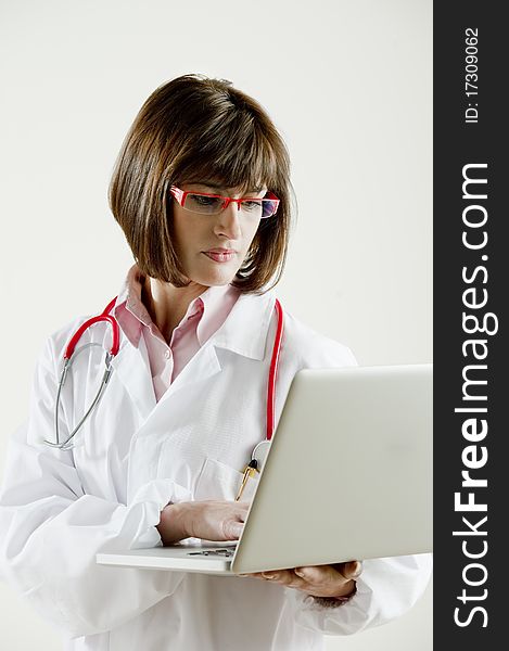 Portrait of a female doctor with laptop