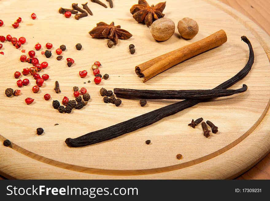 Mix of the spices on the wooden desk