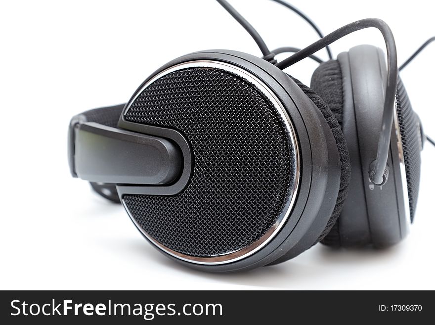 Isolated headphones in black on a white background close up. Isolated headphones in black on a white background close up