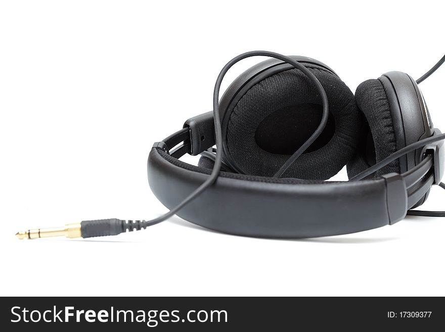 Big black isolated headphones with jack