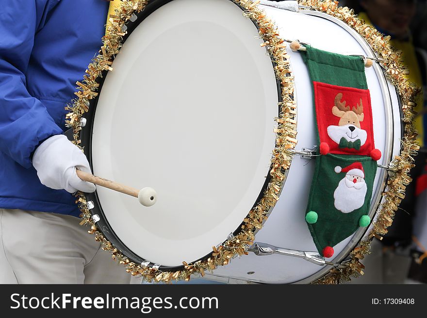 Detail of a marching base drum at a christmas parade. Detail of a marching base drum at a christmas parade