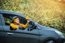 Asian Women Are On Vacation. Drive Happily Traveling To The Mexican Sunflower Flower Garden In Thailand Stock Photo