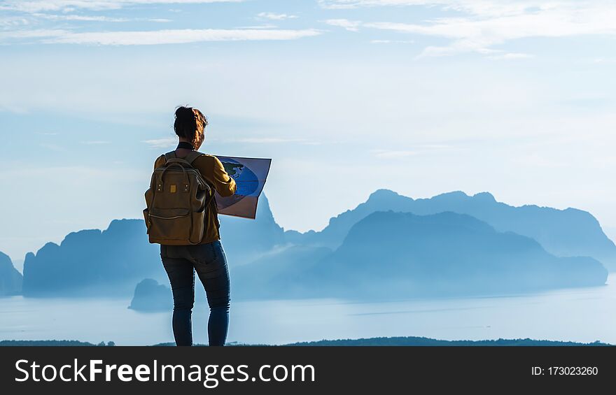 Travelers, young woman are exploring the map. Landscape Beautiful Mountain on sea at Samet Nangshe Viewpoint. Phang Nga Bay ,Travel adventure, Travel Thailand, Tourist on summer holiday vacation. Travelers, young woman are exploring the map. Landscape Beautiful Mountain on sea at Samet Nangshe Viewpoint. Phang Nga Bay ,Travel adventure, Travel Thailand, Tourist on summer holiday vacation.