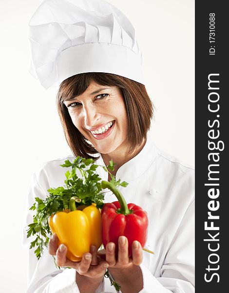 Cheerful Female Chef With Vegetables