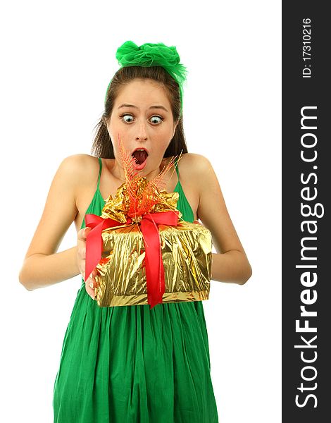 The young surprised girl holds a gift .isolated. The young surprised girl holds a gift .isolated
