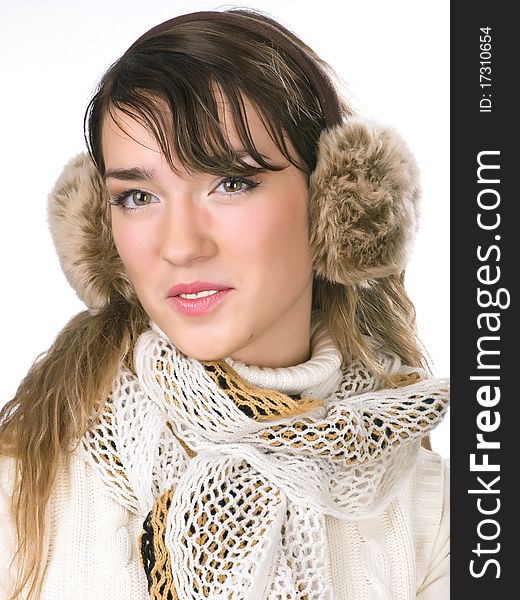 Pretty girl with funny fur earpieces and nice scarf. Pretty girl with funny fur earpieces and nice scarf