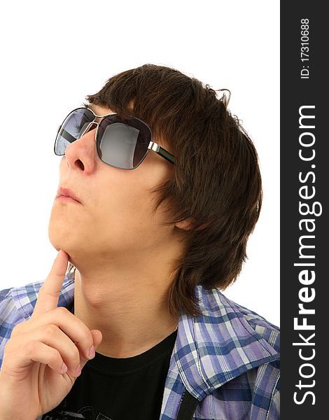 Portrait of thoughtful young man in sunglasses against white background. Portrait of thoughtful young man in sunglasses against white background