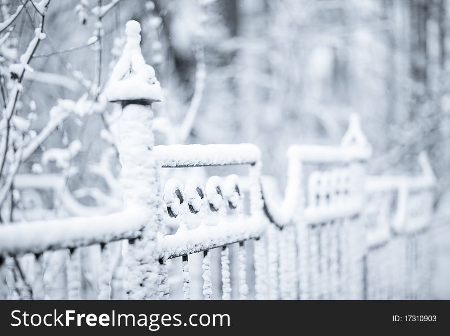 Winter park fence in snow - shallow DOF. Winter park fence in snow - shallow DOF