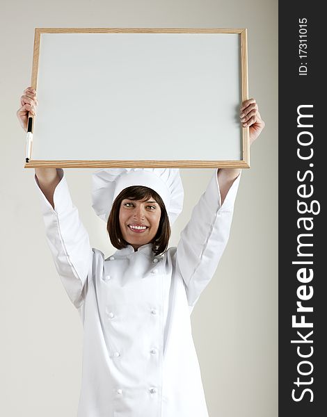 Beautiful female Chef with Blackboard. Beautiful female Chef with Blackboard