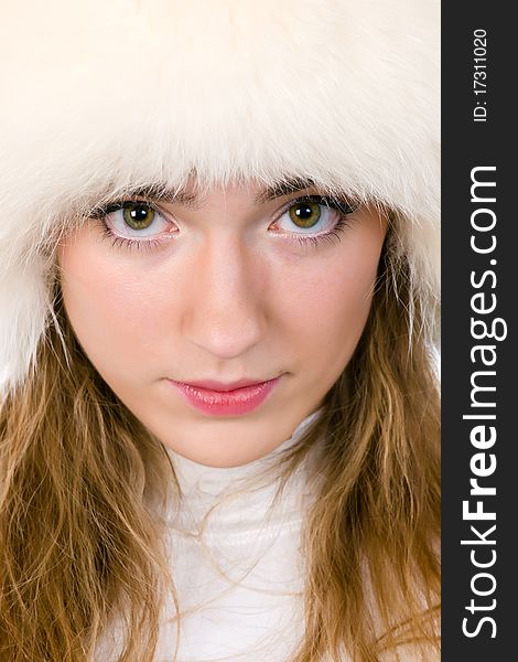 Portrait of young woman in fur cap. Portrait of young woman in fur cap